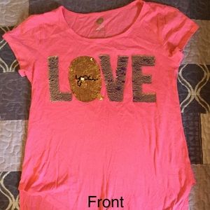 A blouse that says love you on it